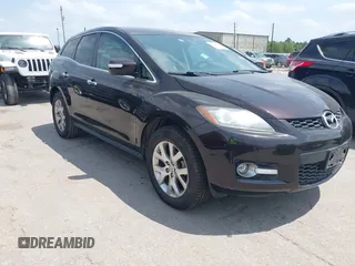 2009 Mazda CX-7 Grand Touring z VIN JM3ER293590219769, wystawiony jako IAAI lot #42080904 z przebiegiem 174 863 mil mil oraz . Historia ofert i sprzedaży dostępna na DreamBid. Obrazek 1.