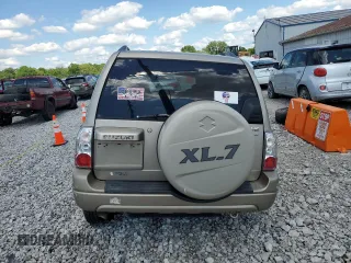 2005 Suzuki XL7 LX z VIN JS3TX92V854105506, wystawiony jako Copart lot #60683524 z przebiegiem 197 035 mil mil oraz Szkody całkowita. Historia ofert i sprzedaży dostępna na DreamBid. Obrazek 6.