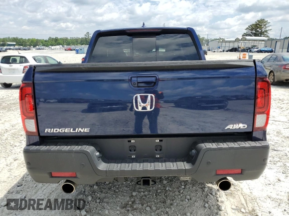 2023 Honda Ridgeline RTL-E with VIN 5FPYK3F74PB037333, listed as a Copart auction lot 56209715 with 36,041 mi miles and Salvage title. Bid and sale history available at DreamBid. Image 6.