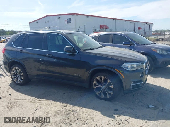 2014 BMW X5 xDrive35d with VIN 5UXKS4C57E0J93982, listed as a IAAI auction lot 42085173 with 169,908 mi miles. Bid and sale history available at carsss.com. Image 14.
