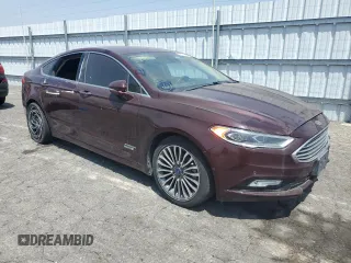 2017 Ford Fusion Titanium z VIN 3FA6P0SU8HR313773, wystawiony jako Copart lot #58791695 z przebiegiem 141 777 mil mil oraz Czysty tytuł • Clean title. Historia ofert i sprzedaży dostępna na DreamBid. Obrazek 4.