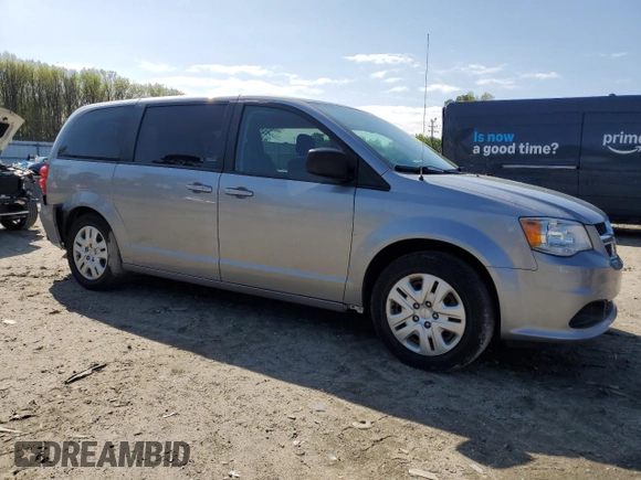 2018 Dodge Grand Caravan SE Plus with VIN 2C4RDGBG0JR136750, listed as a Copart auction lot 50957305 with 106,996 mi miles and Salvage Title. Bid and sale history available at DreamBid. Image 4.