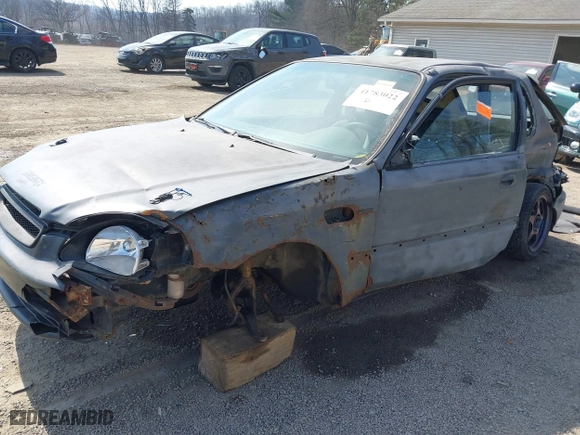 1996 Honda Civic DX with VIN 2HGEJ6344TH115500, listed as a IAAI auction lot 41783022 with 148,439 mi miles. Bid and sale history available at carsss.com. Image 2.