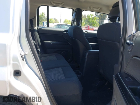 2010 Jeep Patriot Sport with VIN 1J4NT2GBXAD660180, listed as a IAAI auction lot 42146950 with 217,054 mi miles. Bid and sale history available at carsss.com. Image 8.
