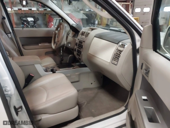 2009 Mercury Mariner Premier with VIN 4M2CU87779KJ14155, listed as a IAAI auction lot 41520138 with 175,980 mi miles. Bid and sale history available at carsss.com. Image 5.