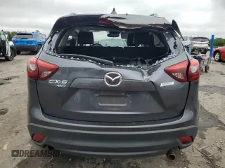 2016 Mazda CX-5 Grand Touring z VIN JM3KE4DY5G0741800, wystawiony jako Copart lot #58565455 z przebiegiem 33 675 mil mil oraz Szkoda całkowita • Salvage title. Historia ofert i sprzedaży dostępna na DreamBid. Obrazek 6.