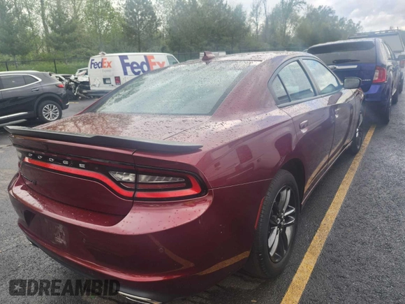 2019 Dodge Charger SXT with VIN 2C3CDXJG4KH589594, listed as a IAAI auction lot 42129447 with 136,021 mi miles and . Bid and sale history available at DreamBid. Image 1.