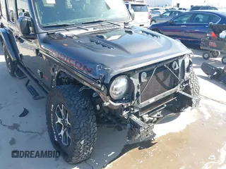 2020 Jeep Wrangler Unlimited Rubicon z VIN 1C4HJXFN0LW300344, wystawiony jako IAAI lot #41943662 z przebiegiem 59 051 mil mil oraz . Historia ofert i sprzedaży dostępna na DreamBid. Obrazek 6.