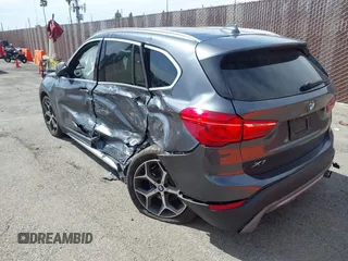 2018 BMW X1 xDrive28i with VIN WBXHT3C30J5L34702, listed as a IAAI auction lot 41935803 with 42,174 mi miles. Bid and sale history available at carsss.com. Image 3.
