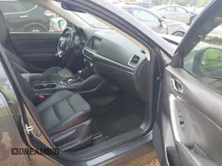 2016 Mazda CX-5 Grand Touring z VIN JM3KE2DY5G0801238, wystawiony jako IAAI lot #42264694 z przebiegiem 136 993 mil mil oraz . Historia ofert i sprzedaży dostępna na DreamBid. Obrazek 5.