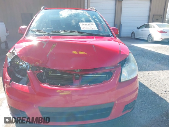 2010 Suzuki SX4 with VIN JS2YB5A34A6301801, listed as a IAAI auction lot 41884838 with 124,381 mi miles. Bid and sale history available at carsss.com. Image 6.