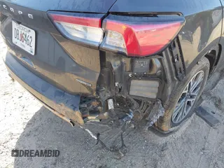 2020 Ford Escape Titanium Hybrid with VIN 1FMCU9DZ2LUA86600, listed as a IAAI auction lot 42059830 with 76,998 mi miles and . Bid and sale history available at DreamBid. Image 6.