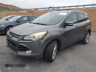 2013 Ford Escape Titanium with VIN 1FMCU0J95DUC71130, listed as a IAAI auction lot 42072032 with 144,054 mi miles and . Bid and sale history available at carsss.com. Image 2.
