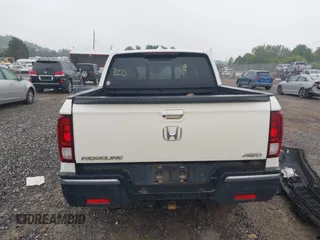 2018 Honda Ridgeline RTL-E with VIN 5FPYK3F77JB017293, listed as a IAAI auction lot 42422614 with 87,700 mi miles and . Bid and sale history available at DreamBid. Image 16.