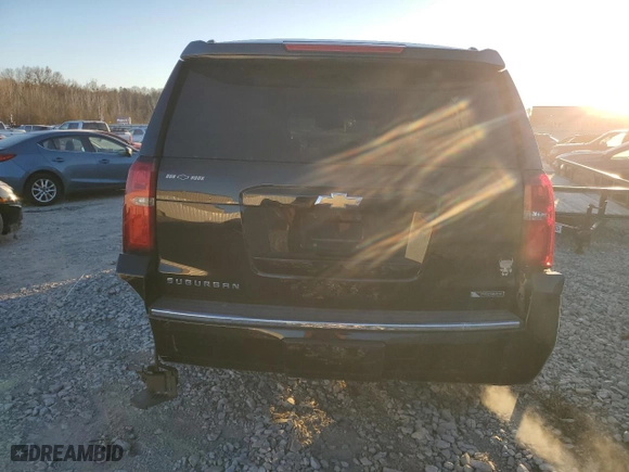 2017 Chevrolet Suburban Premier with VIN 1GNSKJKC5HR303600, listed as a Copart auction lot 83395644 with 124,465 mi miles and Salvage Title. Bid and sale history available at carsss.com. Image 6.