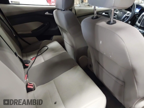 2012 Ford Focus SE с VIN 1FAHP3F21CL301085, выставлен на аукционе IAAI как лот 42321328 с пробегом 157 818 миль миль и . История ставок и продаж доступна на DreamBid. Изображение 8.