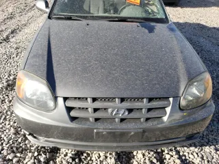 2003 Hyundai Accent GL with VIN KMHCG45CX3U482360, listed as a Copart auction lot 68657183 with 0 mi miles and Salvage Title. Bid and sale history available at carsss.com. Image 12.