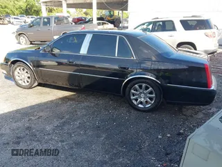 2008 Cadillac DTS 1SC with VIN 1G6KD57Y18U195569, listed as a IAAI auction lot 41936784 with 123,924 mi miles and . Bid and sale history available at carsss.com. Image 3.