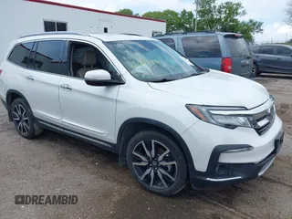 2020 Honda Pilot Touring 8-Passenger with VIN 5FNYF6H96LB037051, listed as a IAAI auction lot 42579931 with 38,946 mi miles and . Bid and sale history available at DreamBid. Image 1.