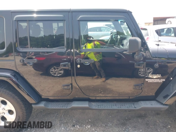 2014 Jeep Wrangler Unlimited Sahara with VIN 1C4BJWEG0EL273086, listed as a IAAI auction lot 42340938 with 121,448 mi miles and . Bid and sale history available at DreamBid. Image 13.