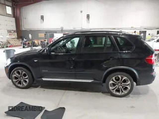2012 BMW X5 50i with VIN 5UXZV8C50CL425721, listed as a IAAI auction lot 42590676 with 192,355 mi miles and . Bid and sale history available at DreamBid. Image 14.
