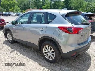 2014 Mazda CX-5 Sport with VIN JM3KE2BEXE0329303, listed as a IAAI auction lot 42556908 with 127,836 mi miles and . Bid and sale history available at DreamBid. Image 3.