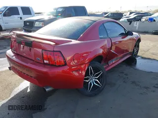 2000 Ford Mustang GT with VIN 1FAFP42X0YF255141, listed as a IAAI auction lot 41558369 with 170,503 mi miles. Bid and sale history available at carsss.com. Image 4.