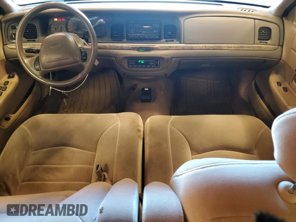 2000 Ford Crown Victoria LX z VIN 2FAFP74WXYX116130, wystawiony jako Copart lot #79441204 z przebiegiem 128 133 mil mil oraz Szkoda całkowita • Salvage title. Historia ofert i sprzedaży dostępna na DreamBid. Obrazek 8.