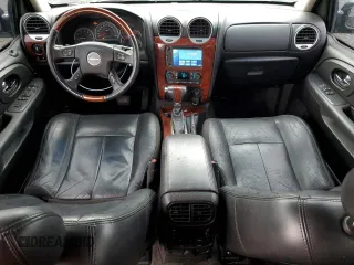 2006 GMC Envoy Denali z VIN 1GKET63M362172474, wystawiony jako Copart lot #58399675 z przebiegiem 182 961 mil mil oraz Czysty tytuł • Clean title. Historia ofert i sprzedaży dostępna na DreamBid. Obrazek 8.