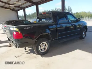 2002 Ford F-150 XLT with VIN 1FTRW08L92KD75087, listed as a IAAI auction lot 41960331 with 1 mi miles. Bid and sale history available at carsss.com. Image 4.