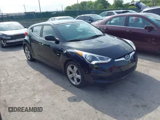 2013 Hyundai Veloster w/Gray Int with VIN KMHTC6ADXDU086856, listed as a IAAI auction lot 42503453 with 187,657 mi miles and . Bid and sale history available at DreamBid. Image 1.