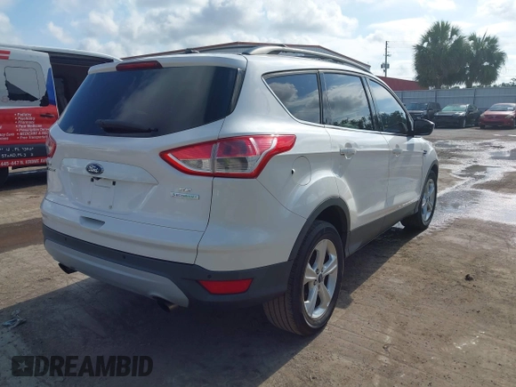 2014 Ford Escape SE with VIN 1FMCU0GX2EUA02753, listed as a IAAI auction lot 42191334 with 205,289 mi miles. Bid and sale history available at carsss.com. Image 4.