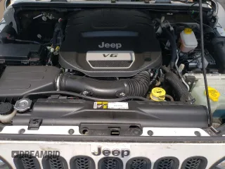 2015 Jeep Wrangler Unlimited Sahara z VIN 1C4BJWEG6FL627890, wystawiony jako Copart lot #58080945 z przebiegiem 145 941 mil mil oraz Szkoda całkowita • Salvage title. Historia ofert i sprzedaży dostępna na DreamBid. Obrazek 11.