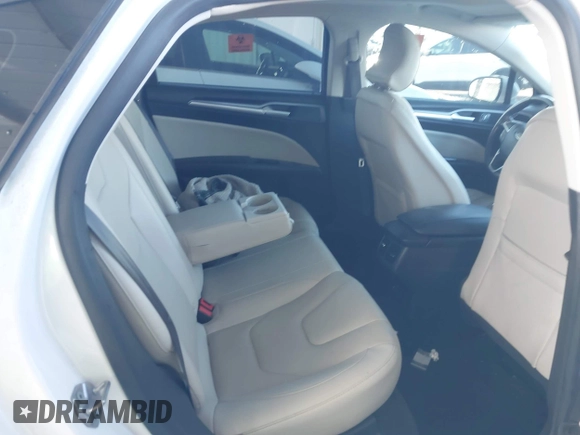 2016 Ford Fusion Titanium Hybrid with VIN 3FA6P0RU1GR191813, listed as a IAAI auction lot 41560954 with 86,922 mi miles. Bid and sale history available at carsss.com. Image 8.