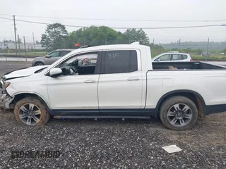 2018 Honda Ridgeline RTL-E with VIN 5FPYK3F77JB017293, listed as a IAAI auction lot 42422614 with 87,700 mi miles and . Bid and sale history available at DreamBid. Image 14.