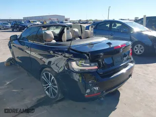 2015 BMW 2 Series 228i with VIN WBA1K5C57FV473826, listed as a IAAI auction lot 41866820 with 130,823 mi miles. Bid and sale history available at carsss.com. Image 3.