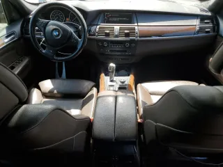 2012 BMW X5 35i with VIN 5UXZV4C54CL744502, listed as a Copart auction lot 57828115 with 161,597 mi miles and Clean title. Bid and sale history available at DreamBid. Image 8.