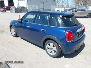2015 MINI Hardtop 4 Door with VIN WMWXS5C58FT829805, listed as a IAAI auction lot 42023026 with 141,330 mi miles and . Bid and sale history available at DreamBid. Image 3.