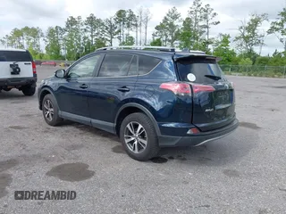2018 Toyota RAV4 XLE with VIN JTMWFREV9JJ165655, listed as a IAAI auction lot 42138998 with 123,569 mi miles and . Bid and sale history available at carsss.com. Image 3.