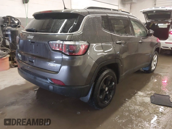 2018 Jeep Compass Altitude with VIN 3C4NJDBB6JT187581, listed as a IAAI auction lot 41542689 with 126,147 mi miles and . Bid and sale history available at carsss.com. Image 4.