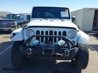 2012 Jeep Wrangler Unlimited Sahara with VIN 1C4BJWEG2CL117080, listed as a IAAI auction lot 41868590 with 92,475 mi miles. Bid and sale history available at carsss.com. Image 6.