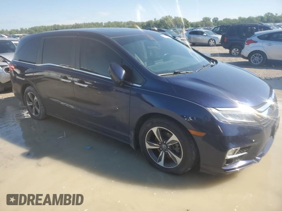 2019 Honda Odyssey Touring with VIN 5FNRL6H80KB100678, listed as a Copart auction lot 58155715 with Not provided miles and Salvage title. Bid and sale history available at DreamBid. Image 4.