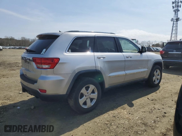 2012 Jeep Grand Cherokee Laredo with VIN 1C4RJFAG4CC123354, listed as a Copart auction lot 52711295 with 151,004 mi miles and Salvage Title. Bid and sale history available at carsss.com. Image 3.
