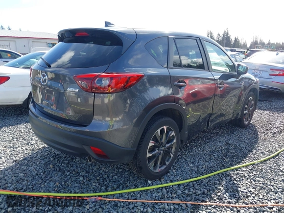 2016 Mazda CX-5 Grand Touring with VIN JM3KE4DY9G0895006, listed as a IAAI auction lot 41703146 with 39,359 mi miles. Bid and sale history available at carsss.com. Image 4.