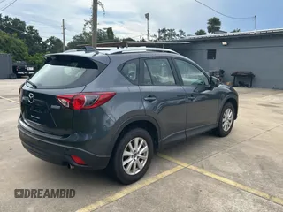 2013 Mazda CX-5 Sport with VIN JM3KE4BE7D0141588, listed as a Copart auction lot 66138585 with 124,920 mi miles and Clean title. Bid and sale history available at DreamBid. Image 4.