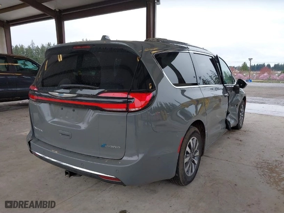 2021 Chrysler Pacifica Hybrid Touring L with VIN 2C4RC1L78MR581255, listed as a IAAI auction lot 41913443 with 71,193 mi miles. Bid and sale history available at carsss.com. Image 4.