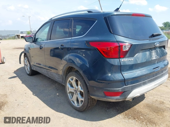 2019 Ford Escape Titanium with VIN 1FMCU9J99KUC00935, listed as a IAAI auction lot 42583250 with 91,241 mi miles and . Bid and sale history available at DreamBid. Image 3.