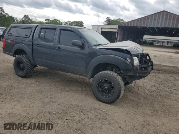 2012 Nissan Frontier Pro-4X with VIN 1N6AD0EVXCC415470, listed as a Copart auction lot 50650915 with 157,160 mi miles and Salvage title. Bid and sale history available at DreamBid. Image 4.