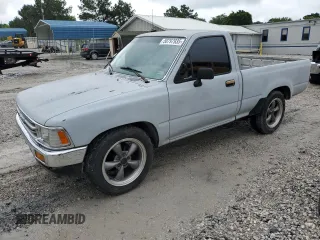 1989 Toyota Pickup DX z VIN JT4RN81PXK0034338, wystawiony jako Copart lot #58797935 z przebiegiem 210 495 mil mil oraz Tytuł czysty. Historia ofert i sprzedaży dostępna na DreamBid. Obrazek 1.