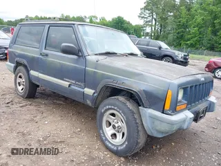2001 Jeep Cherokee z VIN 1J4FT47S11L609530, wystawiony jako IAAI lot #42222446 z przebiegiem 156 408 mil mil oraz . Historia ofert i sprzedaży dostępna na DreamBid. Obrazek 1.